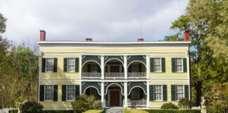 At the end of a pebble-strewn sidewalk, a velvet rope stretches across the porch of historic home Wakefield, where guests will soon line up to meet Lady Carnarvon