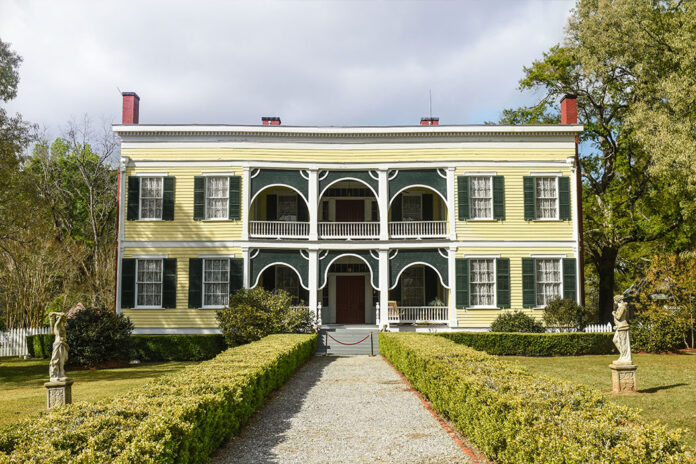 At the end of a pebble-strewn sidewalk, a velvet rope stretches across the porch of historic home Wakefield, where guests will soon line up to meet Lady Carnarvon