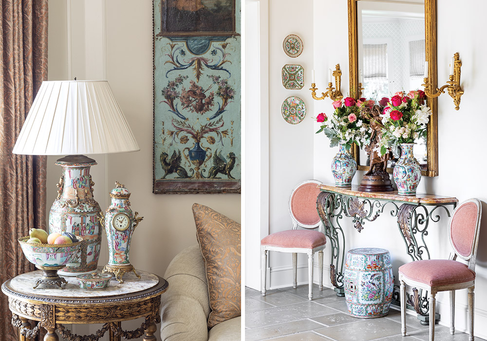 Left: Rose medallion lamp, timepiece, and fruit ball on marble side table. Right: Twin rose medallion vases blooming with peonies and roses on an antique foyer table between two pink chairs, reflected in a tall standing mirror.