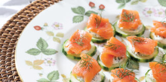 Smoked salmon ribbons the tops of peeled cucumber slices, accented by feathery dill