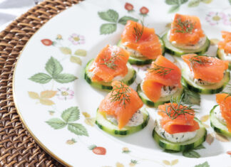 Smoked salmon ribbons the tops of peeled cucumber slices, accented by feathery dill