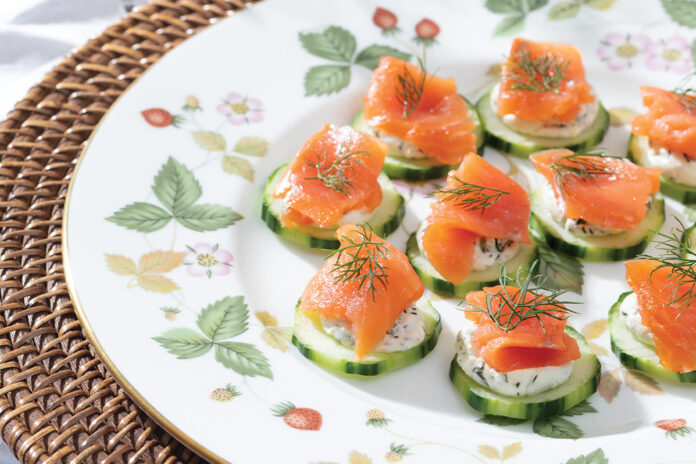 Smoked salmon ribbons the tops of peeled cucumber slices, accented by feathery dill