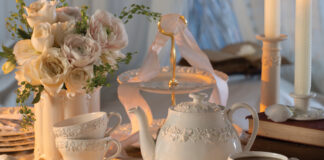 A white teapot and white teacups