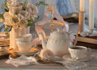A white teapot and white teacups