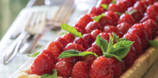 Raspberry tart on a wooden board
