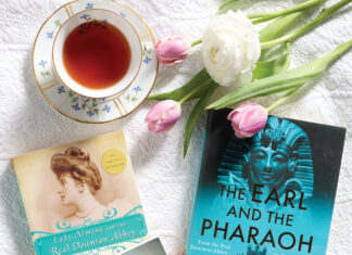 Books with tea cup and tulips