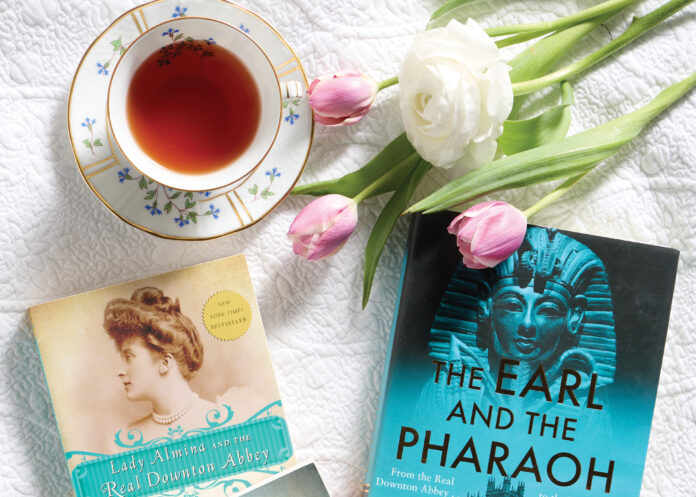 Books with tea cup and tulips