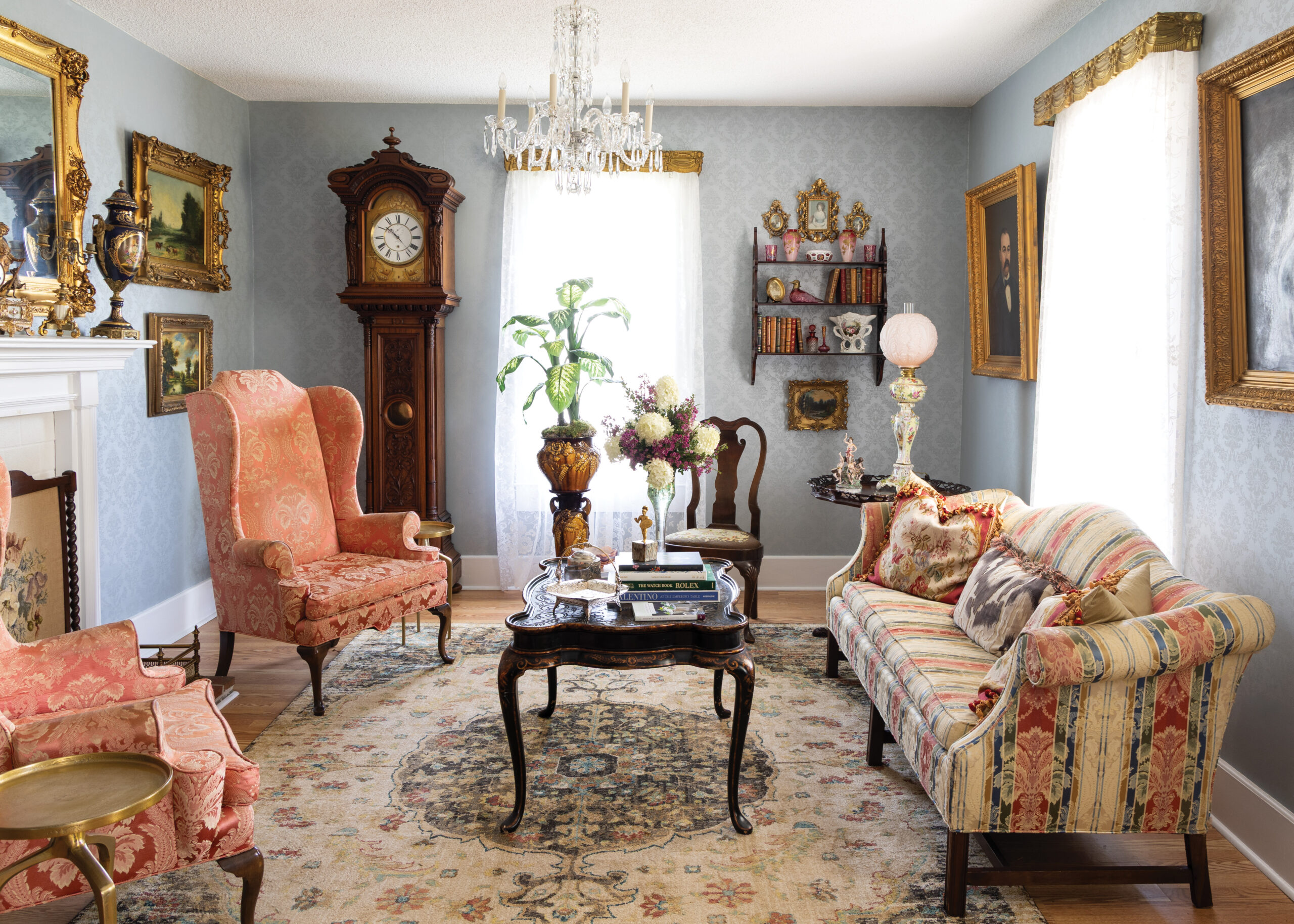 Ornate living room with 2 chairs and couch