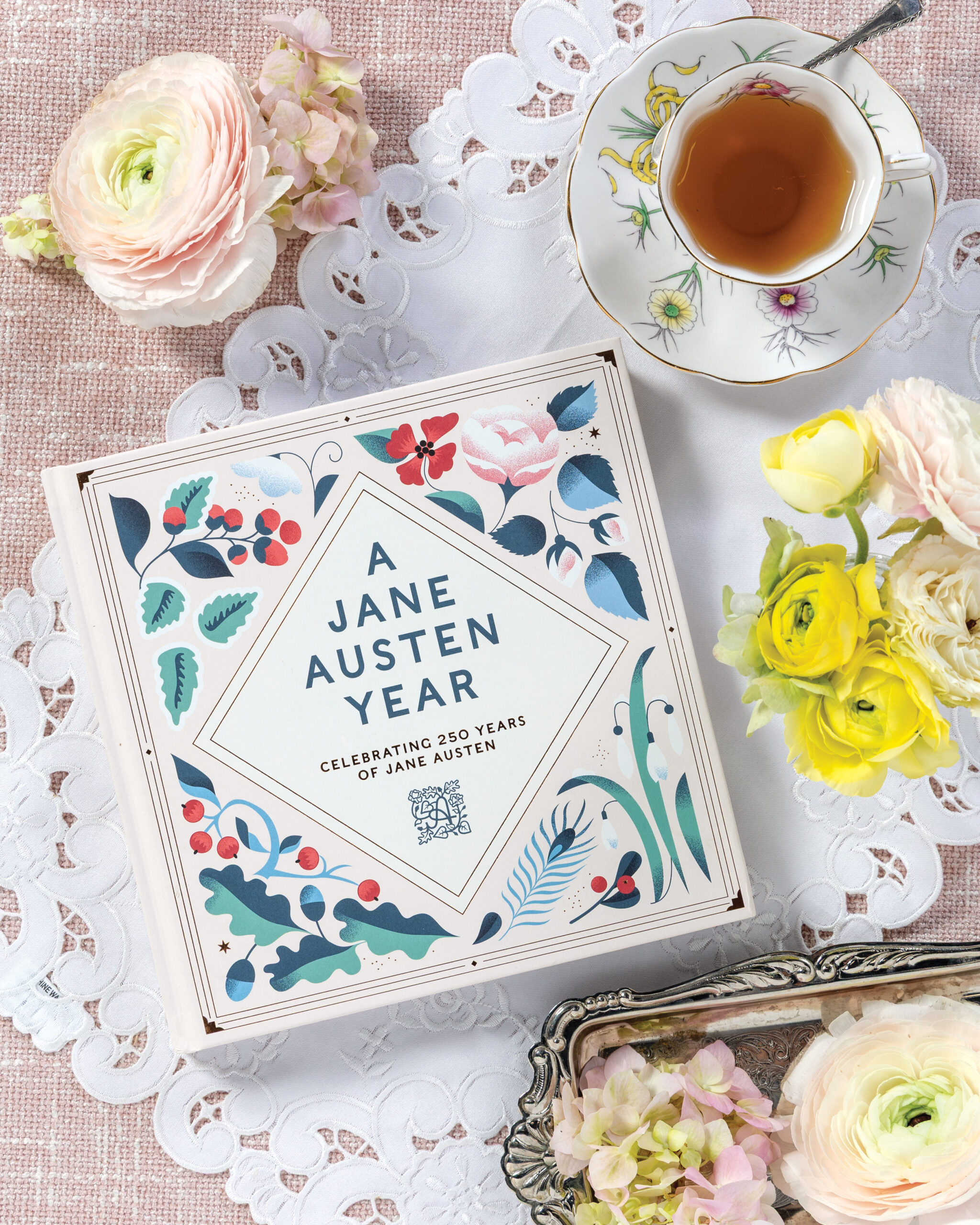 Jane Austen book next to flowers