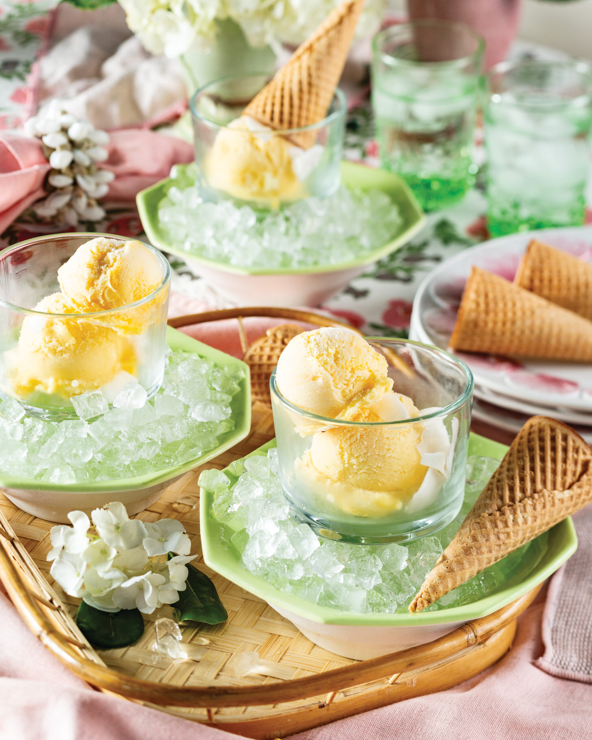 Mango sorbet in glasses next to ice cream cones