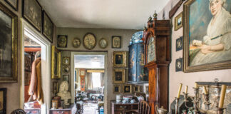 Cottage hallway full of collected antiques
