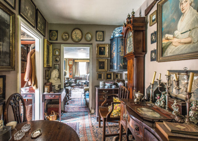 Cottage hallway full of collected antiques