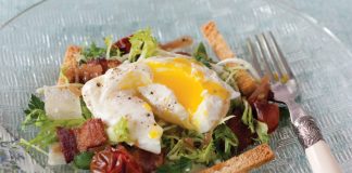 Poached Eggs over Frisée Salad with Roasted Tomatoes