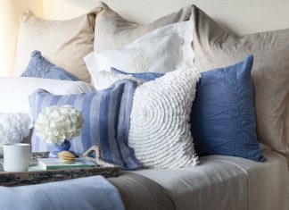 A bed piled high with lofty pillows and layered in luxury often paves the way to a journey into dreamland.