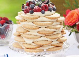 Old-Fashioned Creamy Orange Icebox Cake pairs vanilla-bean shortbread with a zesty buttercream kissed with citrus. A mound of freshly picked berries and a light dusting of confectioners' sugar crowns the show-stopping treat.