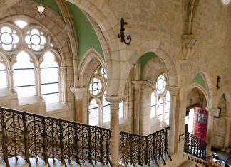 The Abbaye de la Bussière sits along the Arvot River in Burgundy, welcoming guests to a tree- and flower-filled property.