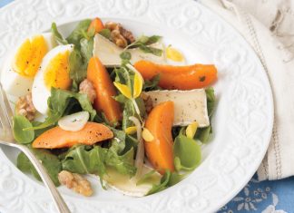Walnuts, fennel, and soft-boiled eggs lend unexpected textural elements to a bed of baby arugula in Apricot-and-Brie Salad.
