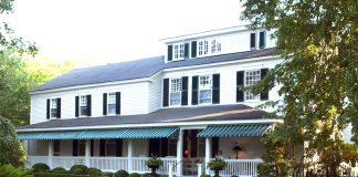 The Charlotte Inn, a historic property, serenely awaits visitors with its updated brilliant white paint and carefully tended lawns.
