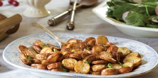 Roasted Salt-and-Vinegar Potatoes—baby reds sliced, cooked, and simply dressed—prove a comforting staple.