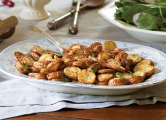 Roasted Salt-and-Vinegar Potatoes—baby reds sliced, cooked, and simply dressed—prove a comforting staple.