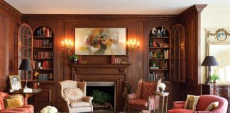 Old-World tradition meets contemporary comfort in the home of Susan and Don Huff, where the patina of aged-oak paneling in the living room serves as a fitting backdrop for character-infused antiques.