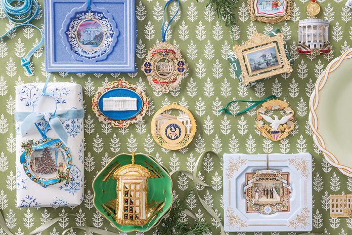 Historic Holiday Decor: White House ornaments viewed from above, atop a green-and-white paper surface, a collection of White House ornaments is carefully displayed.
