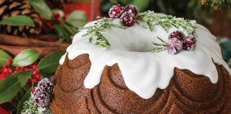 Our Gingerbread Bundt Cake is dressed with sugared rosemary and cranberries, set to look like holly.