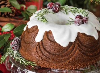 Our Gingerbread Bundt Cake is dressed with sugared rosemary and cranberries, set to look like holly.