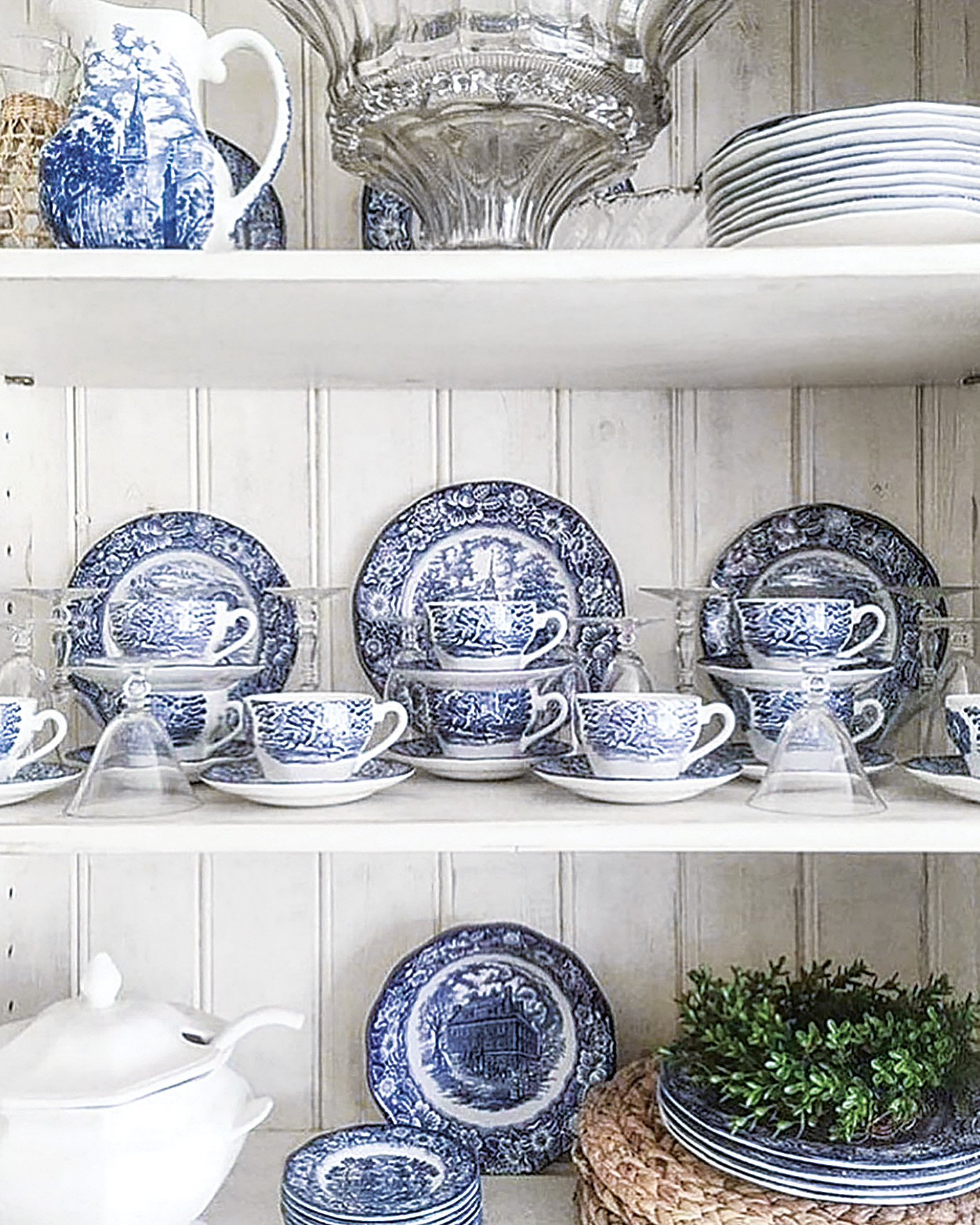 Shelves hold stacks of blue-and-white transferware at Tallwood Country House.