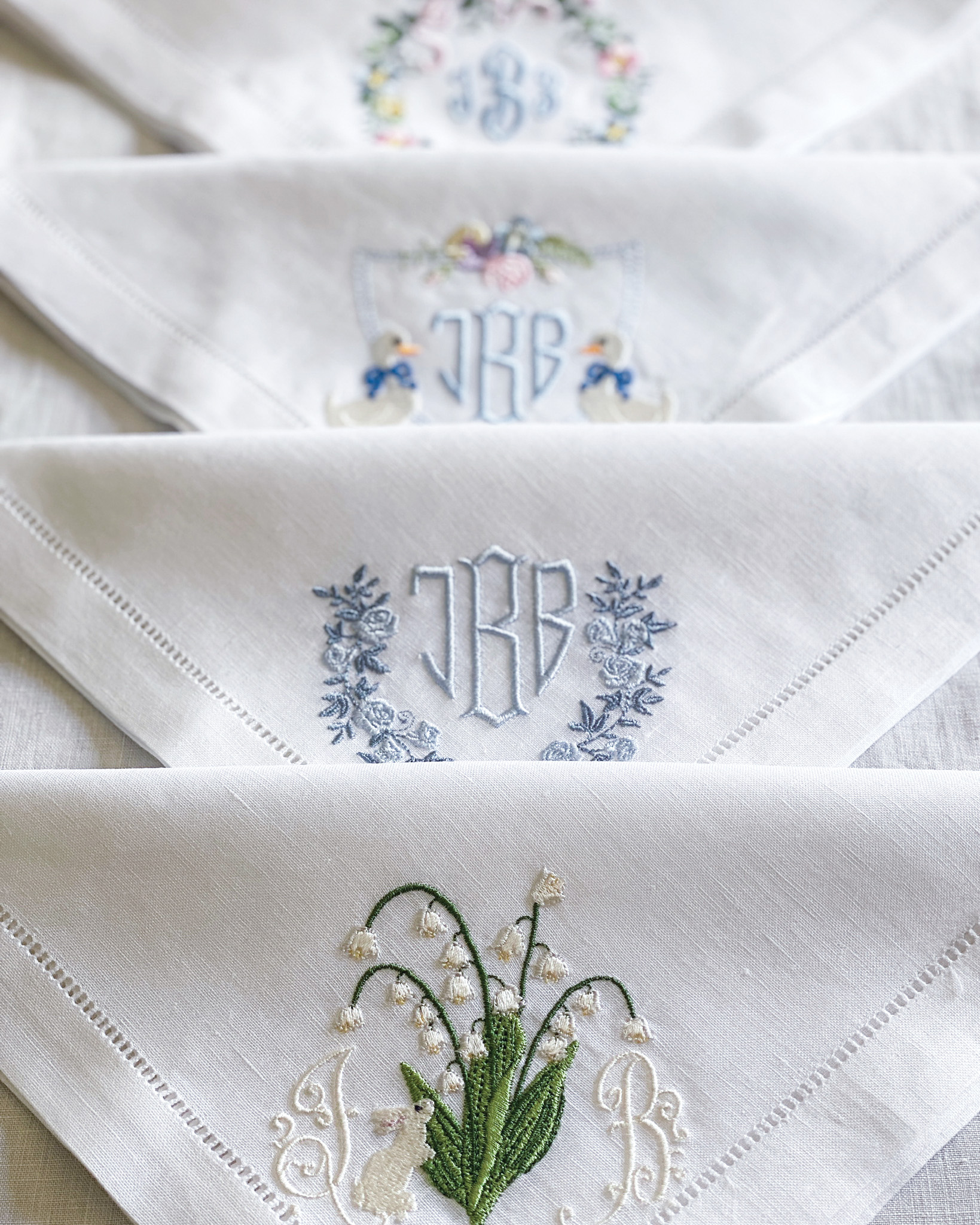 A trio of napkins showcase pretty embroidery.