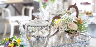 Teatime Bliss 2023 Preview Featured Silver Tea Service Alt Text: Set atop a silver tray, a silver tea set awaits the occasion.