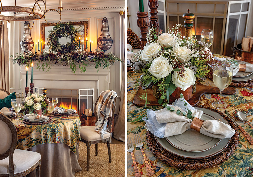 A table positioned before the hearth is dressed to match the mantel, with evergreen candlesticks, white roses, and pinecones.