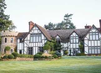 This half-timber-style home bears some architectural resemblance to a castle in addition to an English cottage.