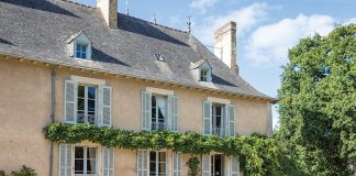 The east wing of the château is draped in wisteria vines.