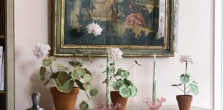 Discover the unique joy and experience at Tallwood, where loving work to restore and furnish the residence invites readers into the allure of French décor. Handmade paper flowers decorate the top of a desk in the home of Victoria Artist-in-Residence Jenny Bohannon.