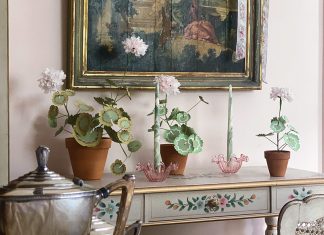 Discover the unique joy and experience at Tallwood, where loving work to restore and furnish the residence invites readers into the allure of French décor. Handmade paper flowers decorate the top of a desk in the home of Victoria Artist-in-Residence Jenny Bohannon.