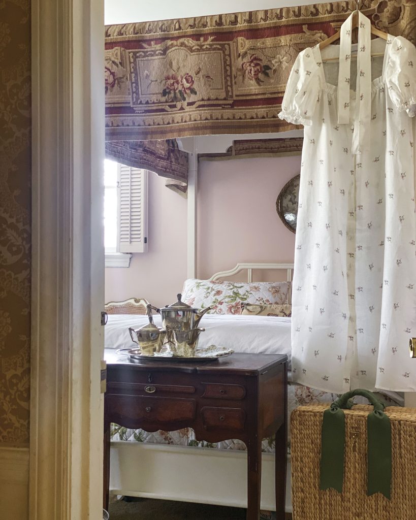 Jenny Bohannon uses a vintage Aubusson rug as a canopy in the primary bedroom at Tallwood.