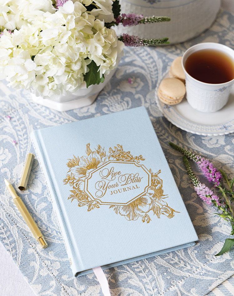 French Dreams Live Your Bliss blue cloth journal with tea and flowers.
