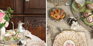 A small table is draped in antique French lace, set for an intimate tea for two. The silver tray holds priceless porcelain cups and saucers bearing feminine portraits.