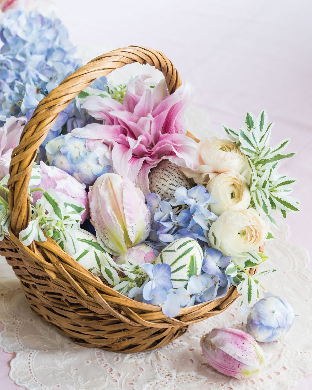 A basket of Easter eggs dressed in flower petals makes for a fitting seasonal display.