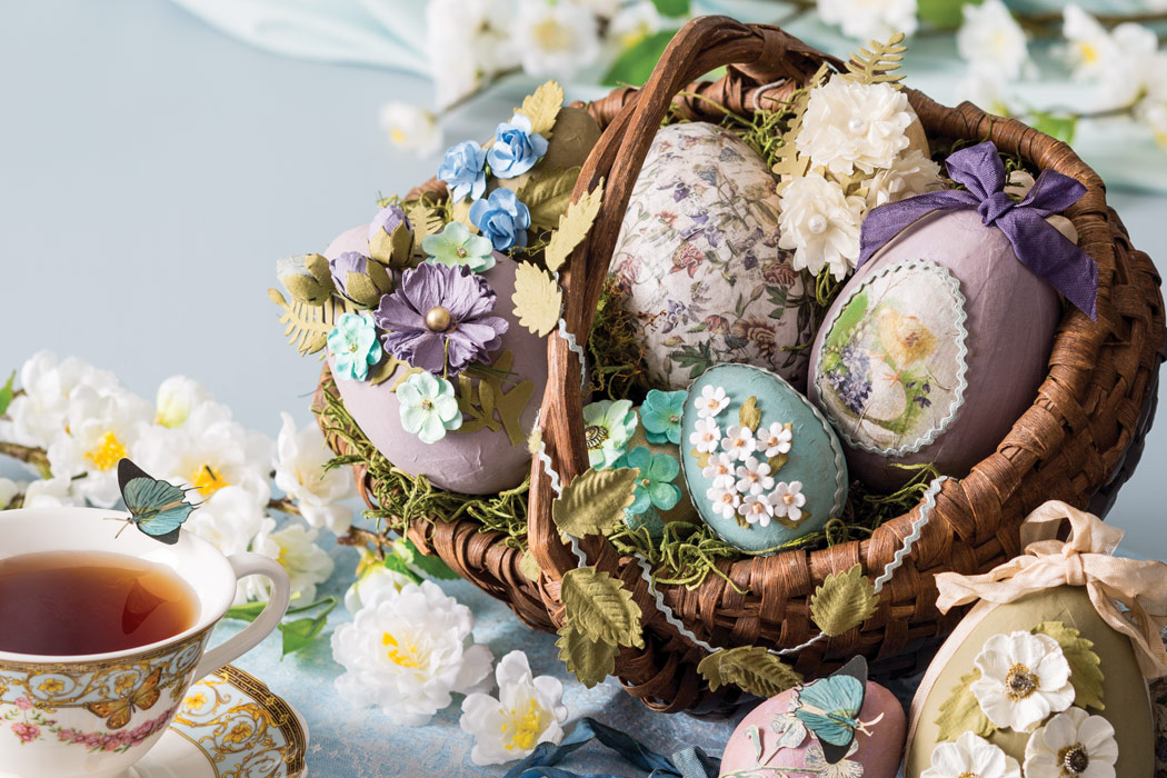 Tucked into glass displays, these eggs are adorned in hand-cut paper inspired by Mother Nature.