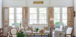 A bright living room expertly combines antique and modern furnishings.