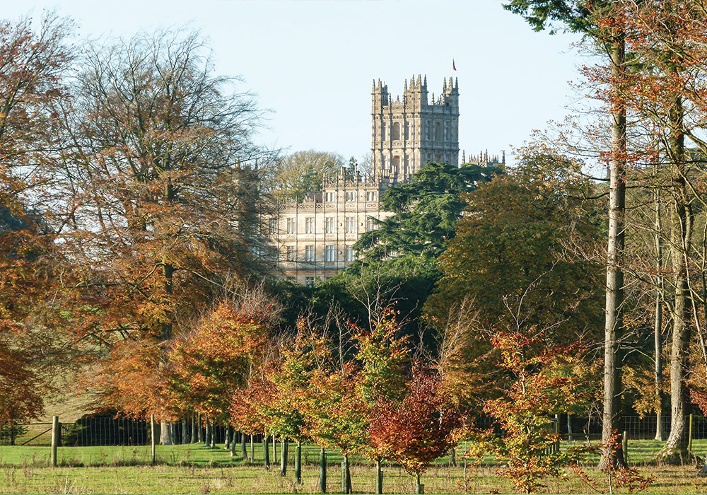 Autumn trees surround Highclere Castle