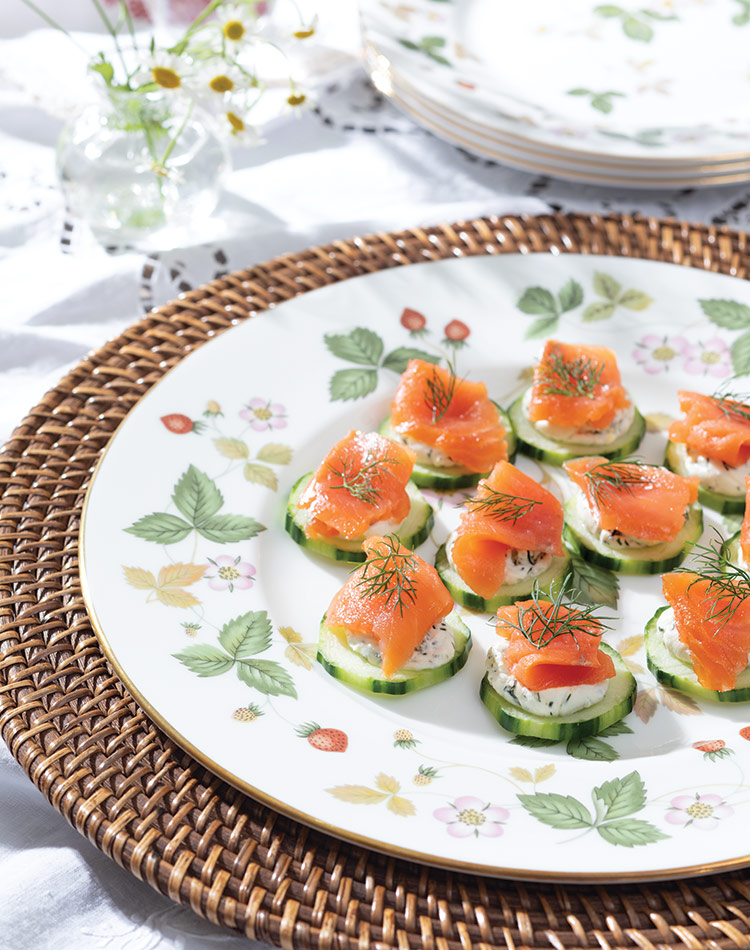 Smoked salmon ribbons the tops of peeled cucumber slices, accented by feathery dill