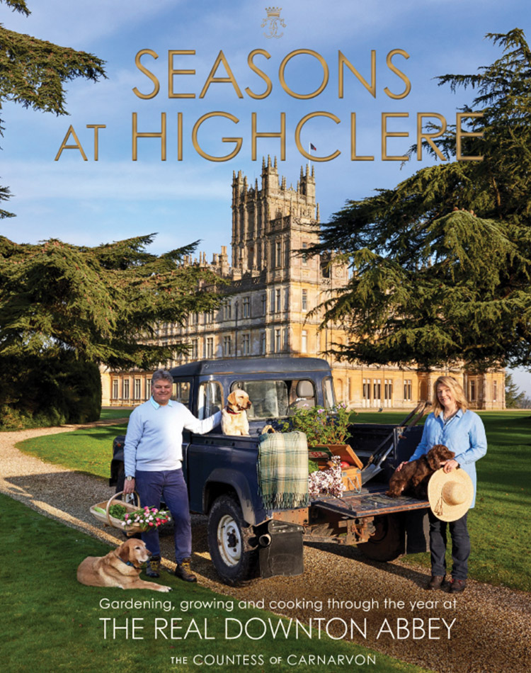 The cover of the book Seasons at Highclere shows Earl and Lady Carnarvon, along with three dogs, gathered around a pickup truck with Highclere Castle in the background.