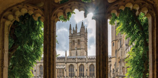 The halls of Magdalen College are filled with history and are as beautiful as they are old. Here, the sun shines beyond the main tower and into the courtyard.