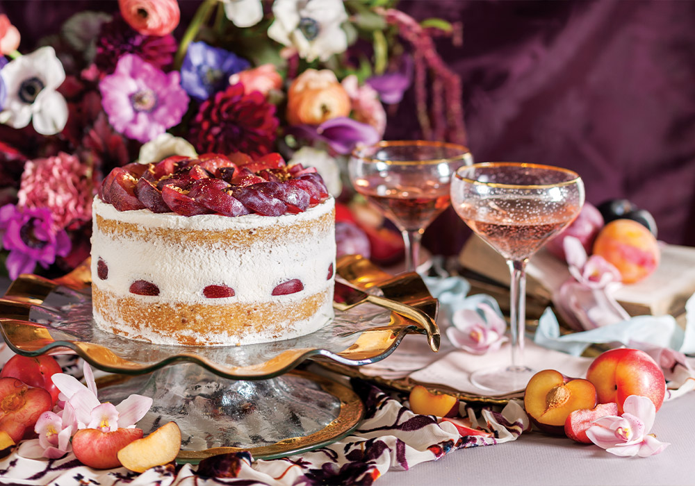 Hazelnut Cake with Whipped Topping and Plums.