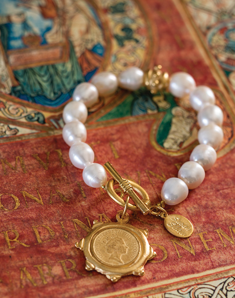 Gold jewelry from Canvas Style bears the image of the beloved late Queen Elizabeth II.