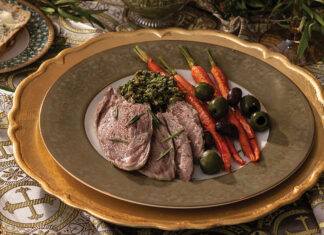 For a hearty entrée, we serve Roasted Leg of Lamb, flavored with woodsy rosemary and the bright citrus of orange zest. The bone-in cut cooks alongside mixed olives and baby carrots and is plated with these tasty components and refreshing carrot-mint pesto.