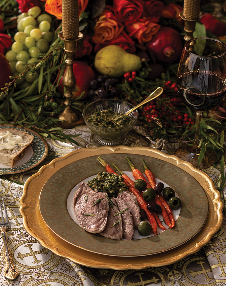 For a hearty entrée, we serve Roasted Leg of Lamb, flavored with woodsy rosemary and the bright citrus of orange zest. The bone-in cut cooks alongside mixed olives and baby carrots and is plated with these tasty components and refreshing carrot-mint pesto.